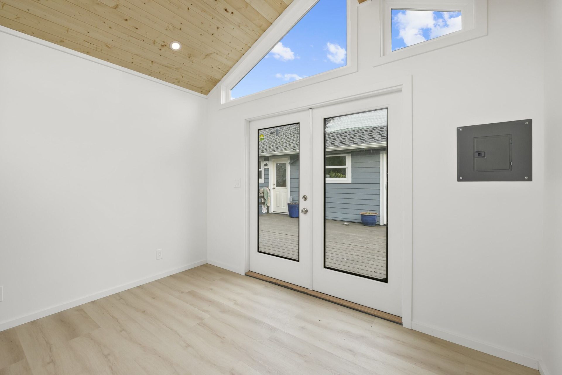 Empty room with sliding glass door and window