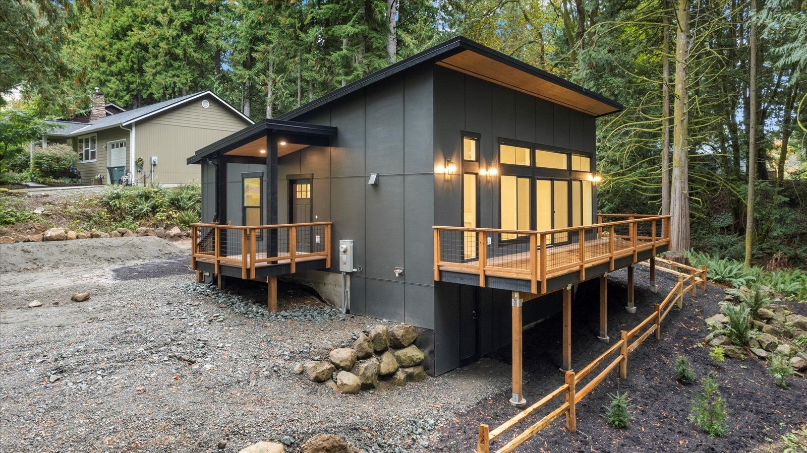 Small house with a wooden deck in the forest