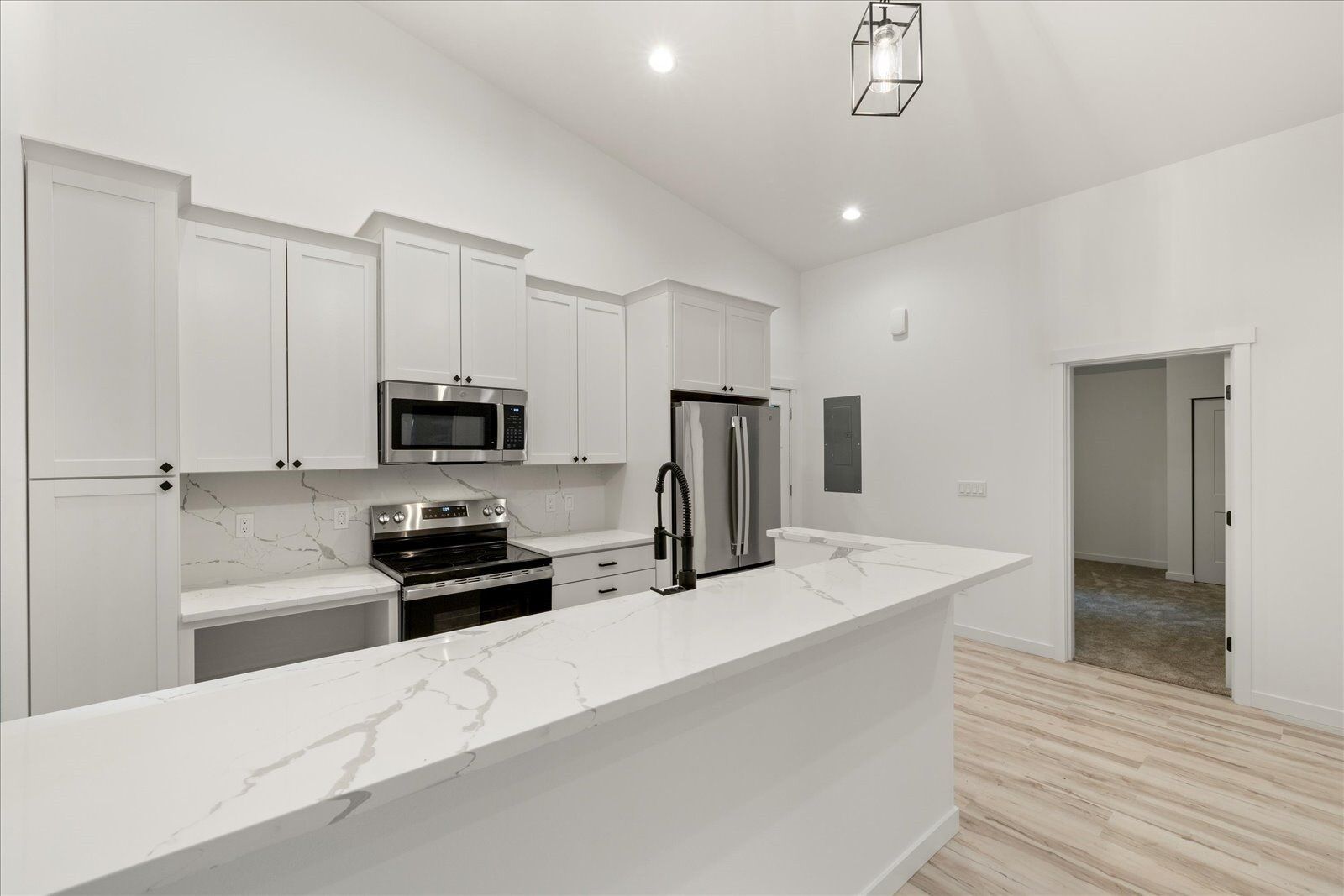 Kitchen with white cabinets and stainless appliances