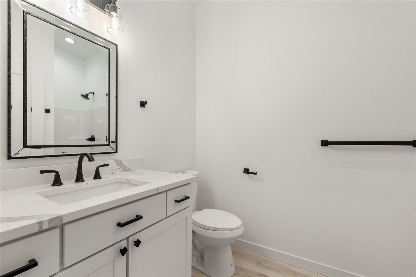 Bathroom with sink, toilet and mirror