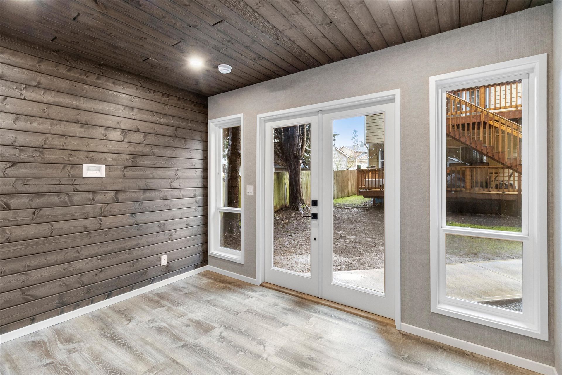 Coast Studio interior with grey wood-paneled walls